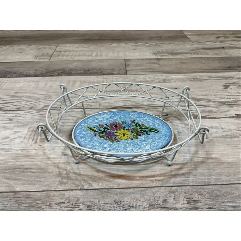 Temp-tations Ovenware by Tara Blue oval covered casserole dish with a metal stan